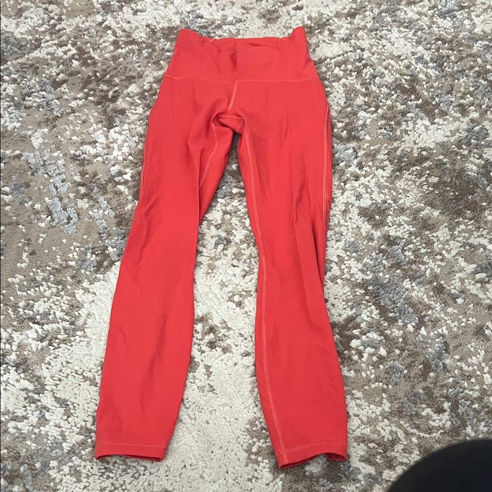 Perfect condition size 2.  Pumpkin orange color. Lululemon leggings.